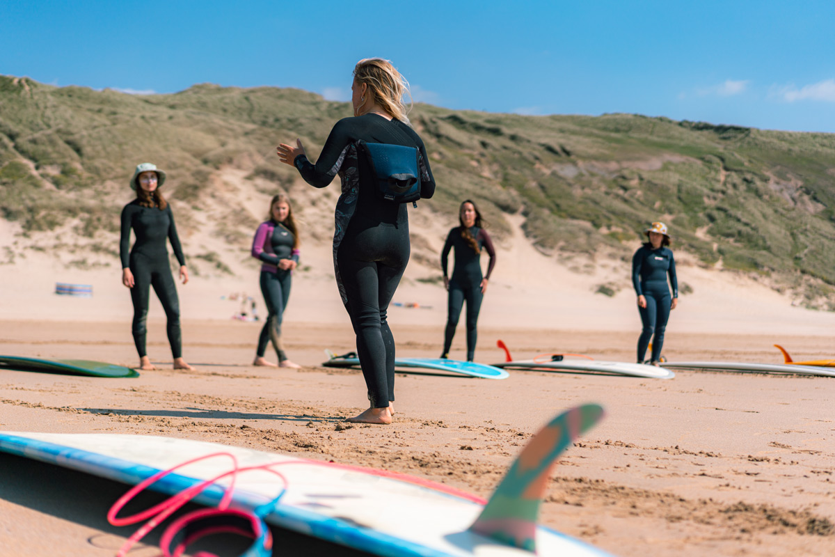 A surf lesson at Gather and Glide surf, one of Cornwall's surf schools