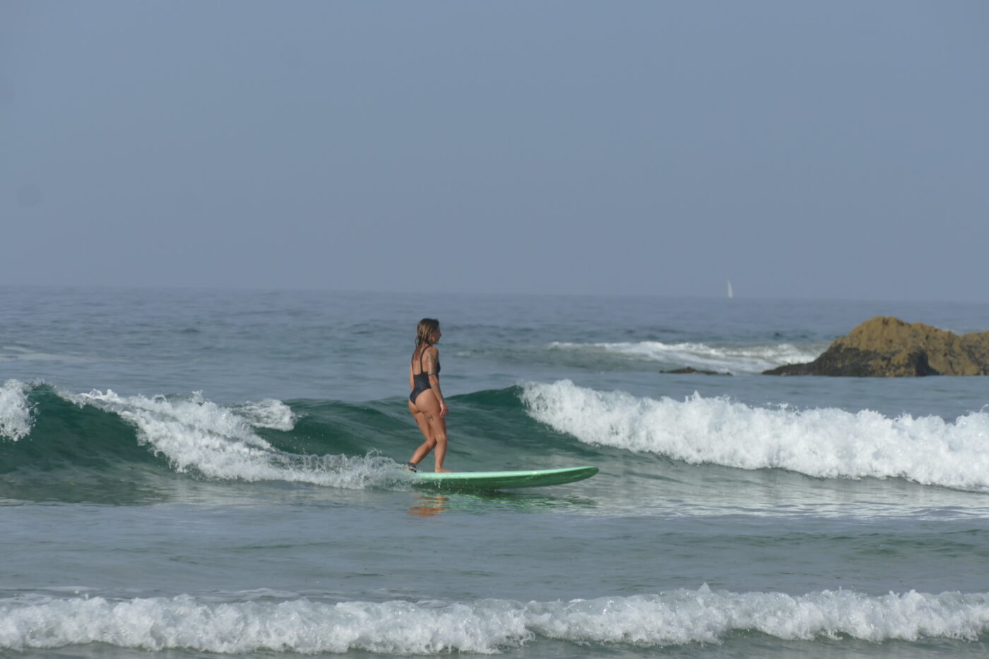 Surfing on the Align with Nature Retreat, founded by Ines Robim